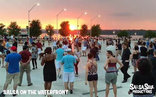 Group of salsa dancers at the outdoor rink