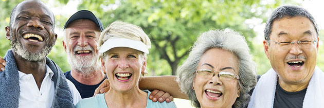 Group of smiling older adults outdoors