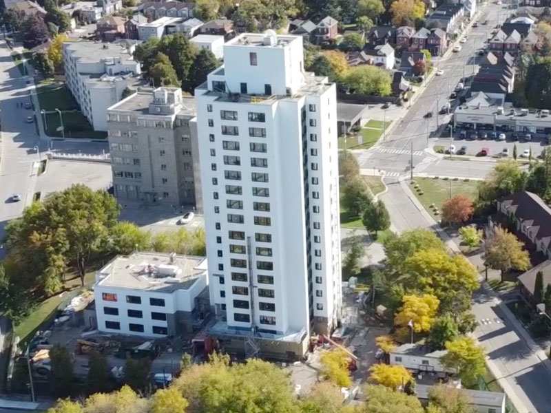 Overhead view of white apartment building