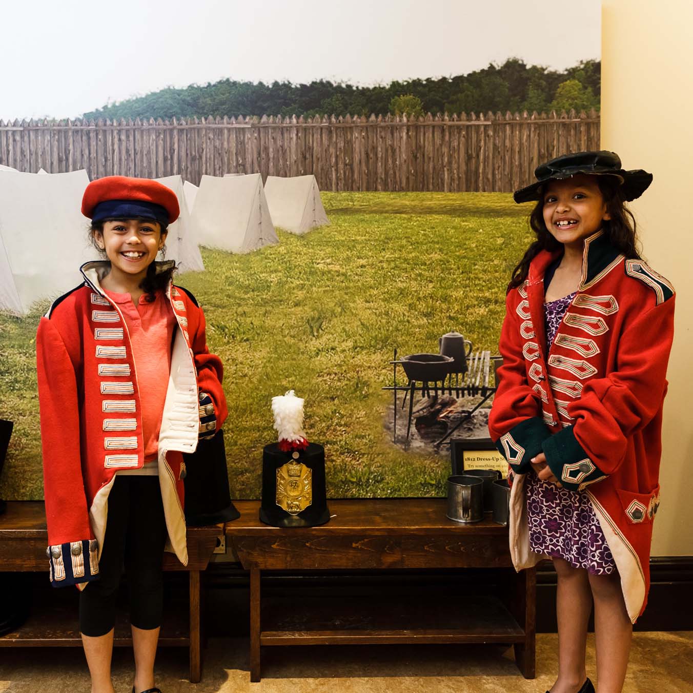 2 young girls dressed in turn of the century military attire