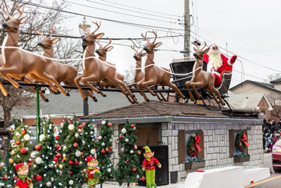 Santa Claus parade, Santa on a parade float in a sleigh with reindeer