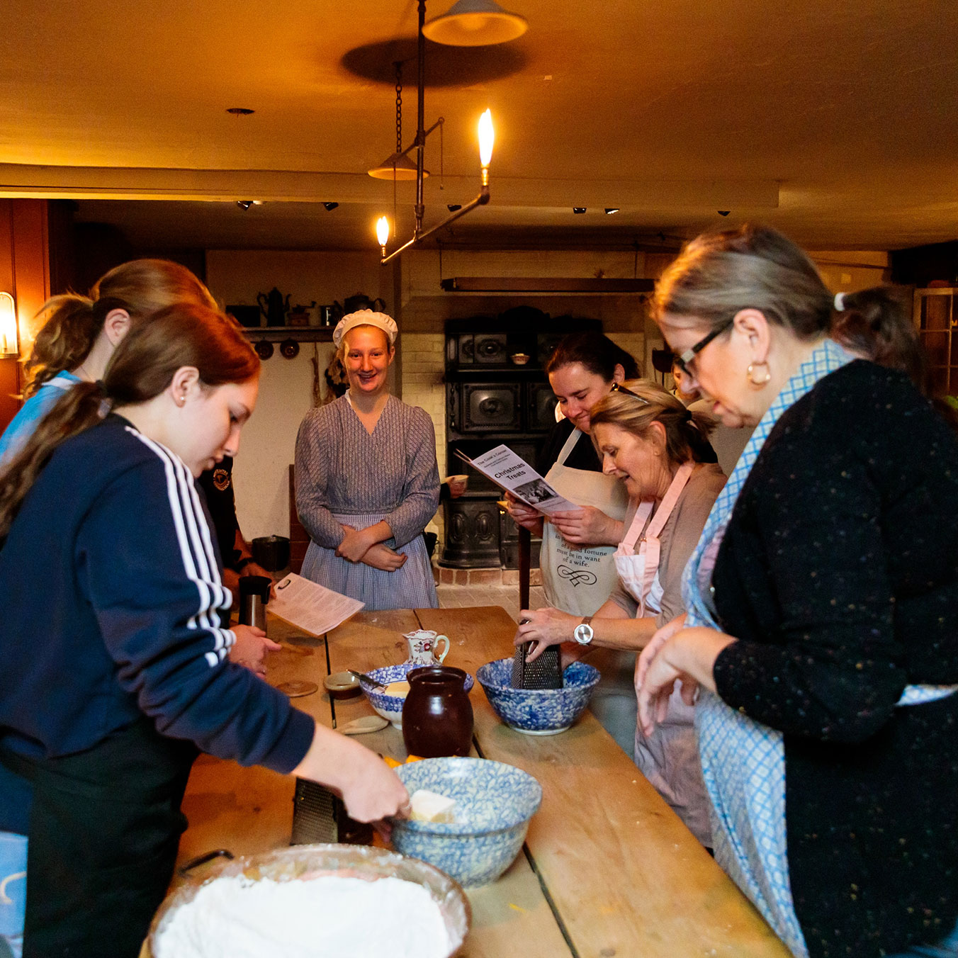 Group of people making pastries during cooking workshop at Dundurn