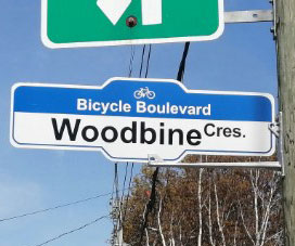 Sign for Bicycle Boulevard for Woodbine Crescent on electric pole