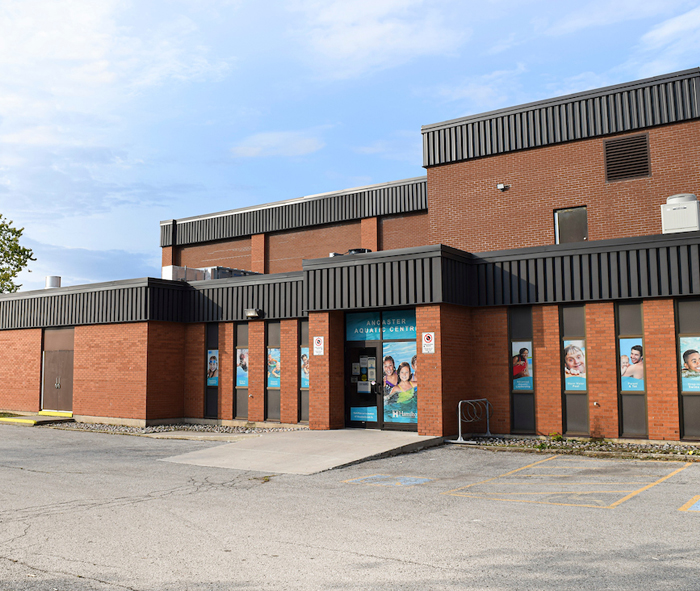 External view of Ancaster Aquatic Centre building doors with centre name above them