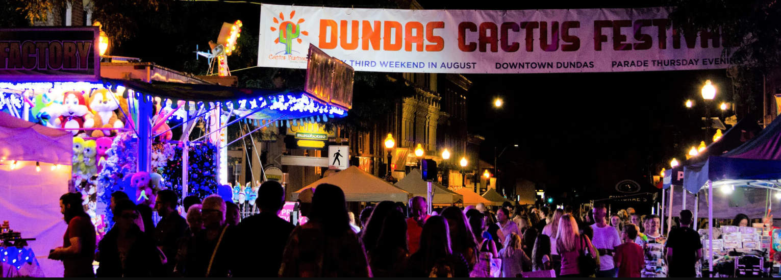 Crowd at night with street banner