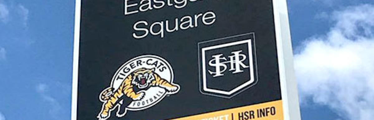 Image of a sign post, text "Ticats Game Day Express Bus Stop"