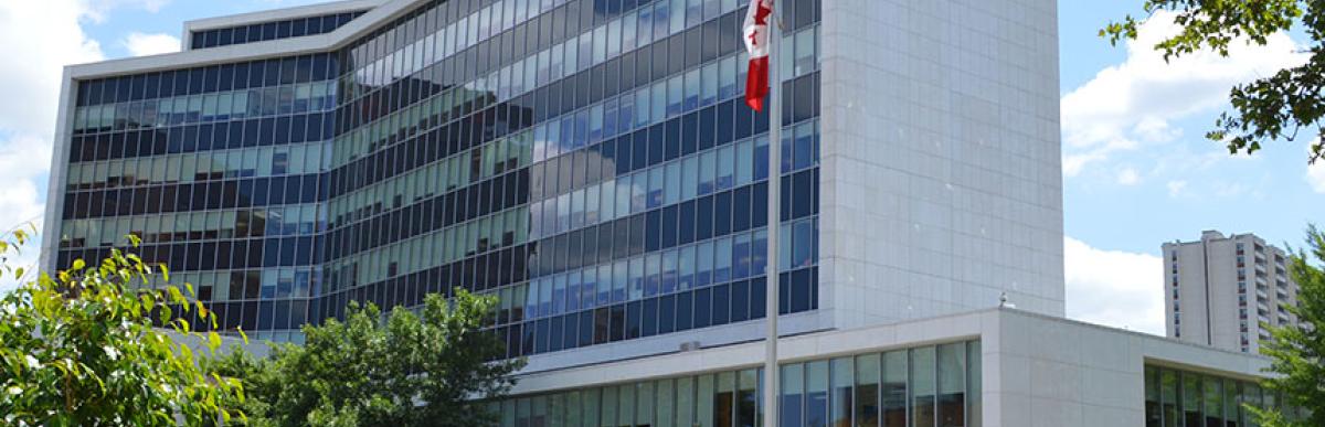 Exterior shot of Hamilton City Hall in the sunshine with blue sky