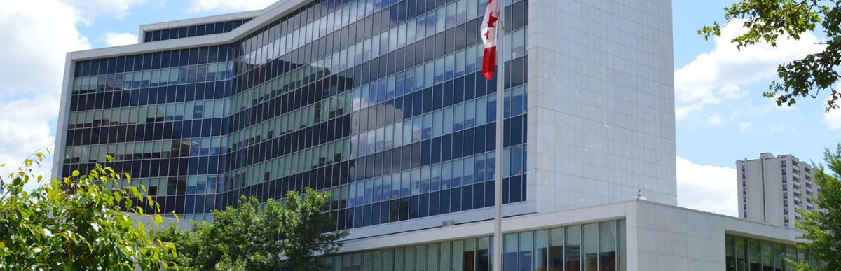 Exterior shot of Hamilton City Hall in the sunshine with blue sky