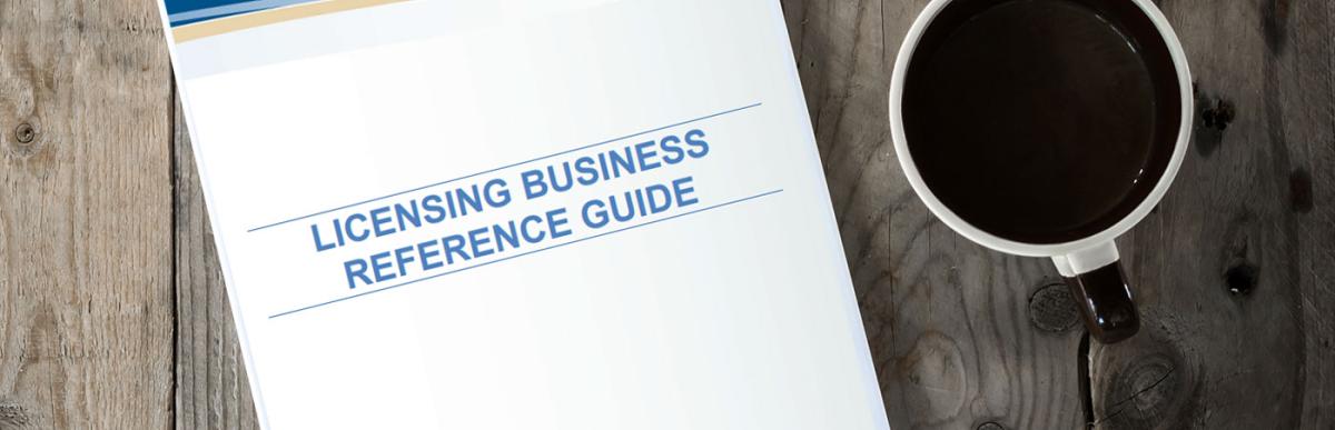 Business Licence Reference Guide on table with cup of coffee