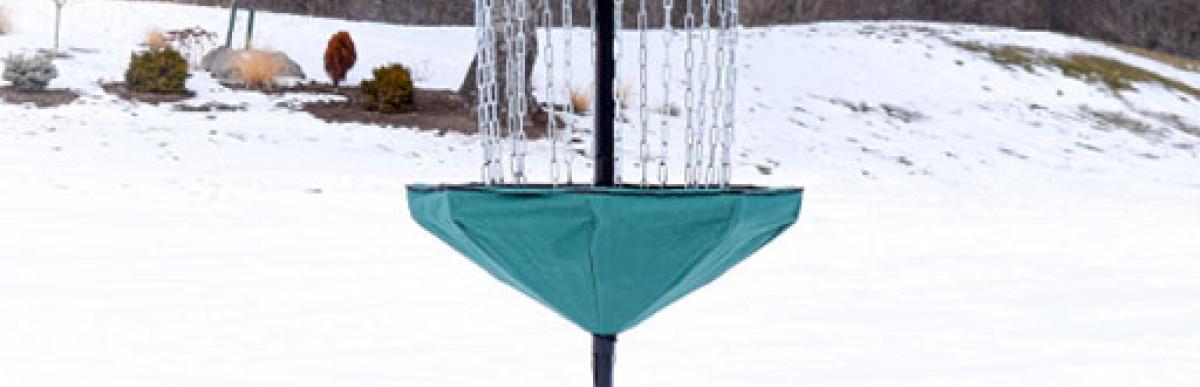 Disc golf target in the snow at King's Forest.