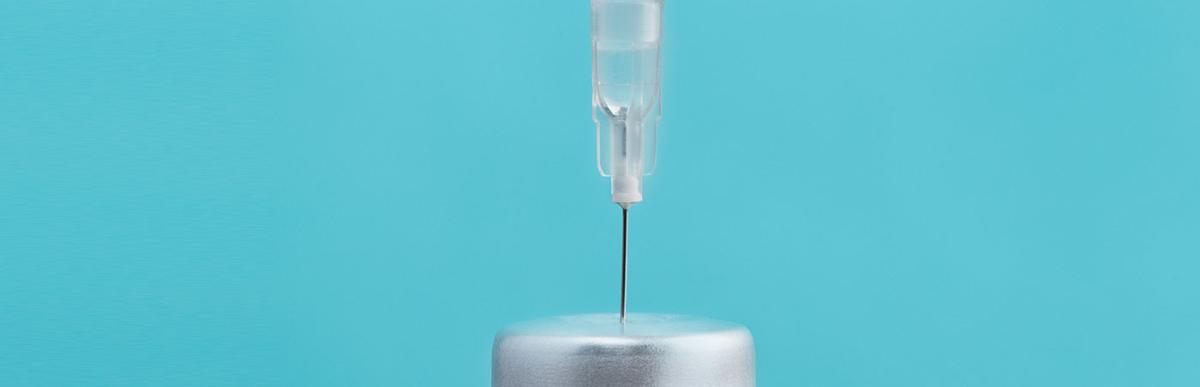 Close up of a medical vial and syringe, vaccination concept