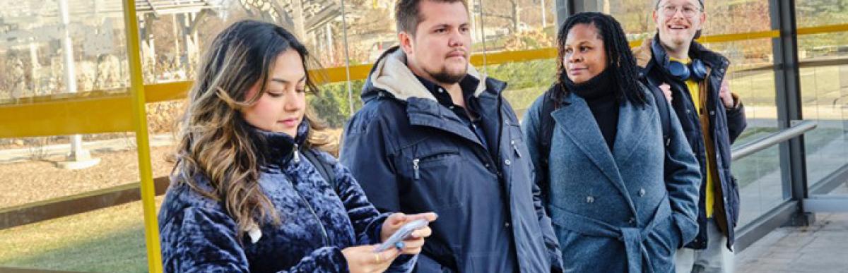 riders at mohawk college bus stop