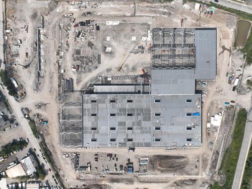 Overhead shot. Outline of the maintenance shop (top structure in picture) and the bus storage area (bottom structure in picture). Driveway connection to Birch Avenue has been established.